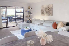 Modern three bed two and a half bath with in and outdoor flow plus study